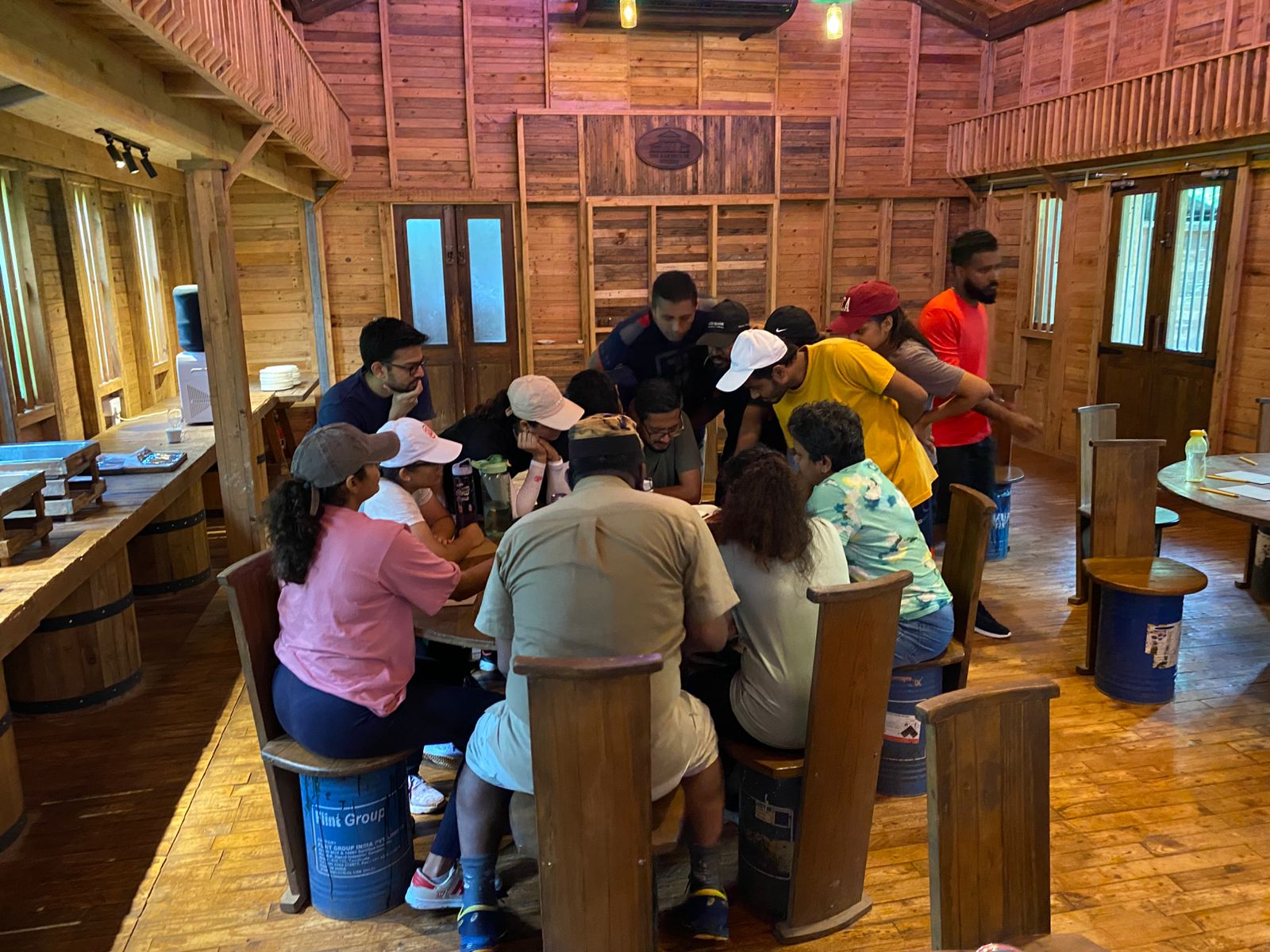 Team strategy session inside the wooden Barn hall