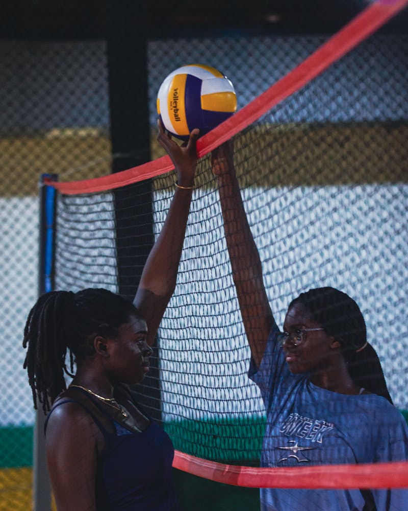 Volleyball players at the net