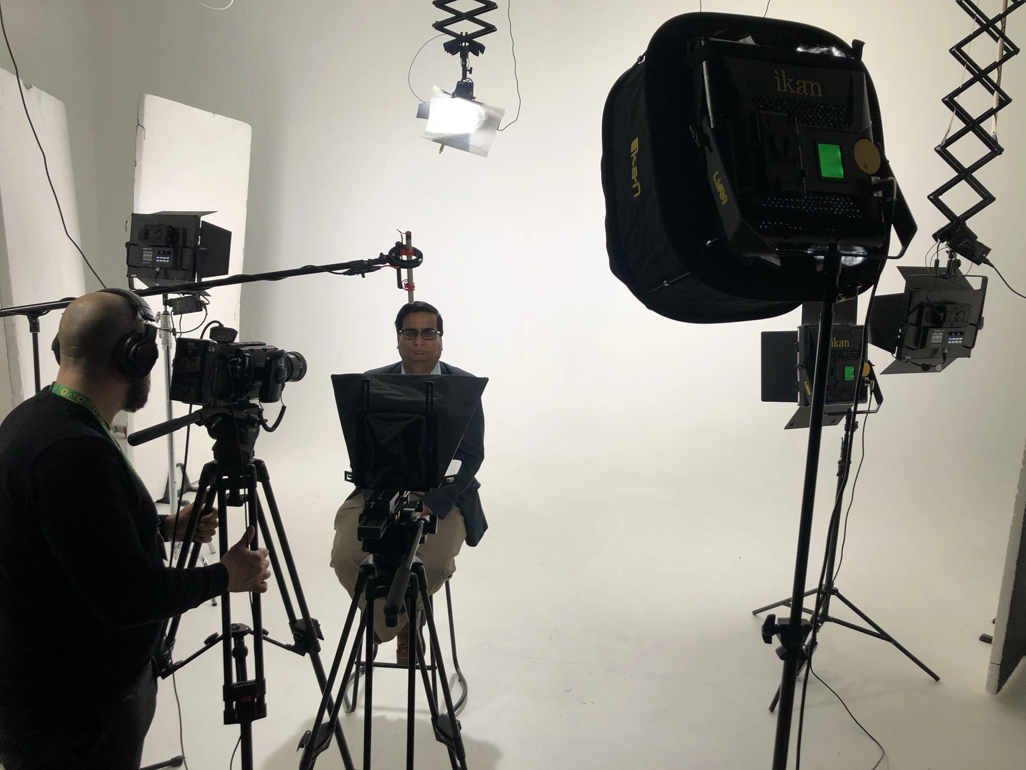 Camera operator setting up a client interview