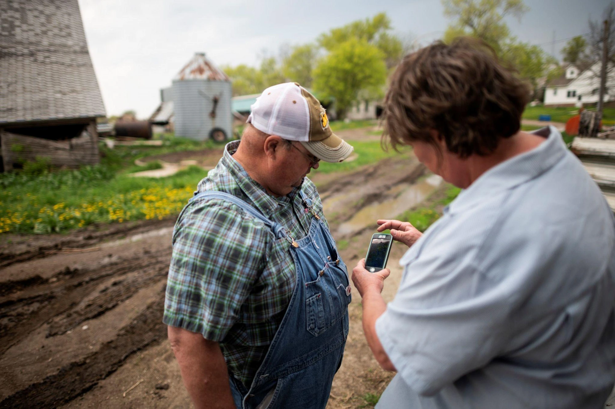 Two neighbours compare notes on the land they share — the seed of every restoration project is a conversation.